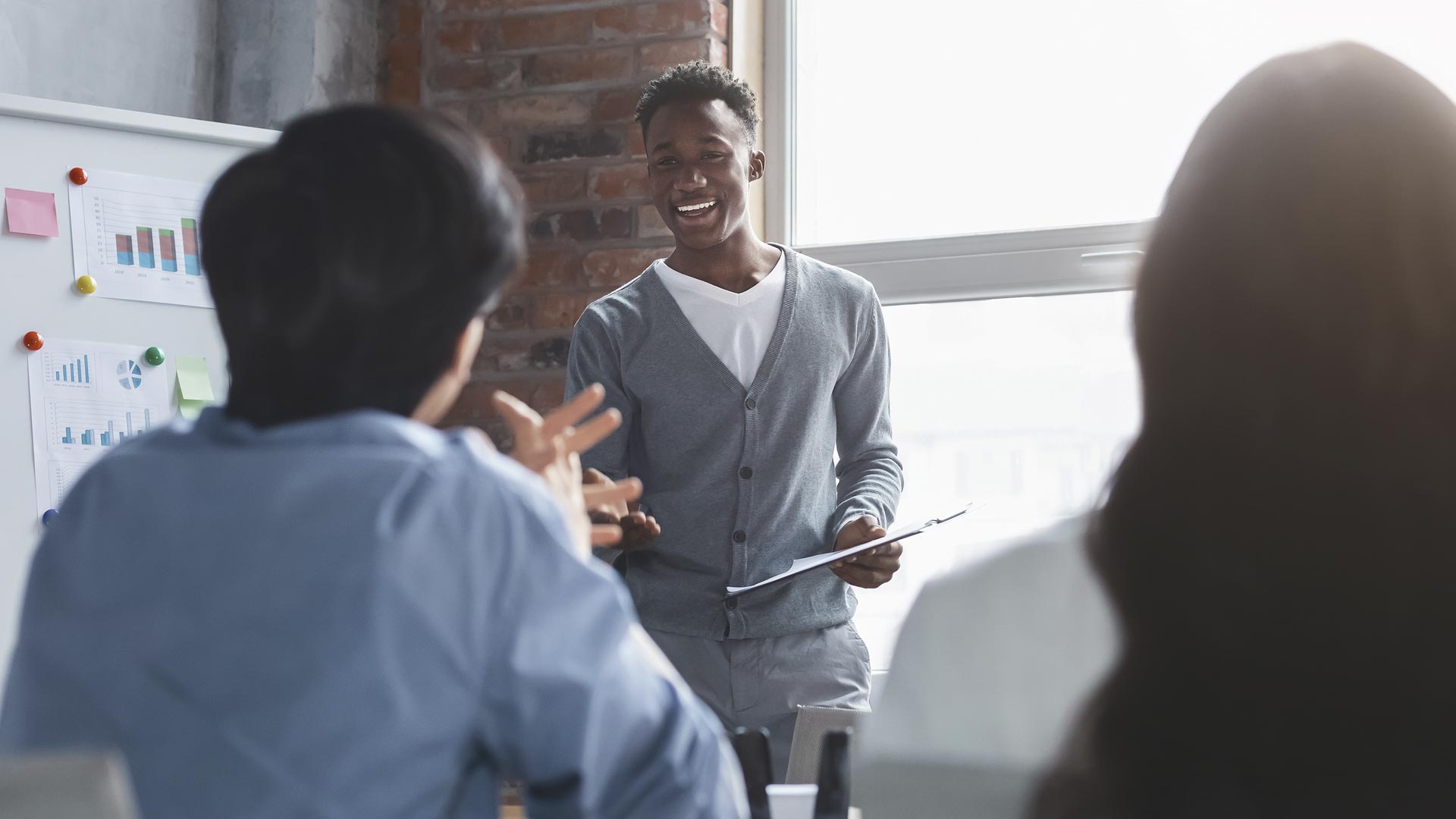 People meeting and writing on a white board