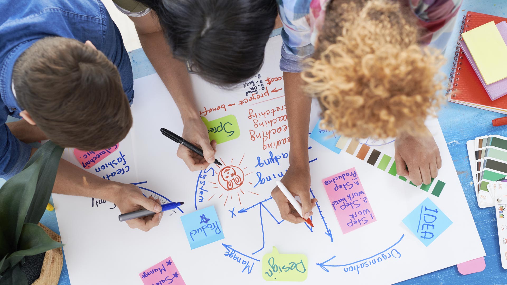 Group of people writing on paper
