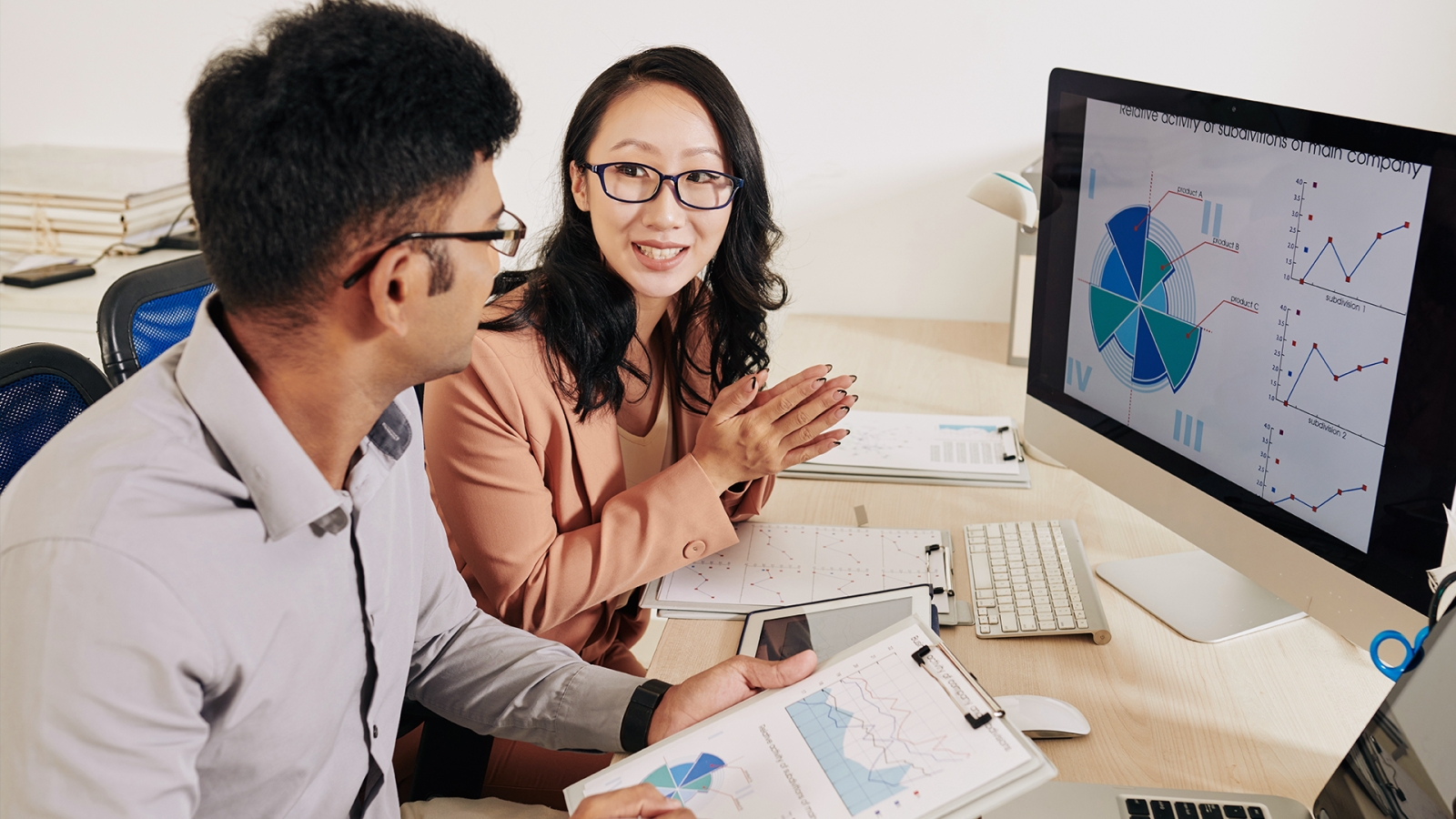 Two people assessing data