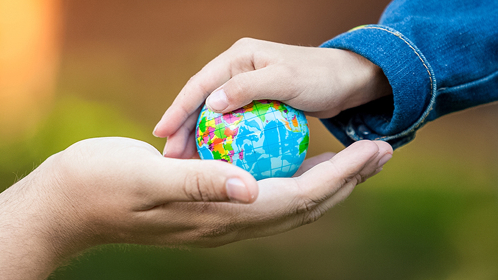 Hands on a globe