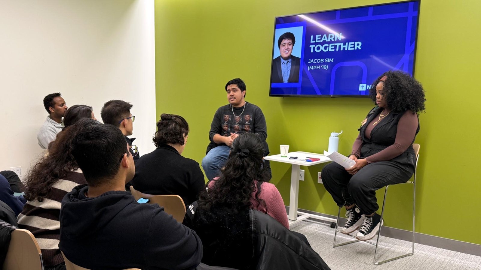Alumni presenting to a group of students