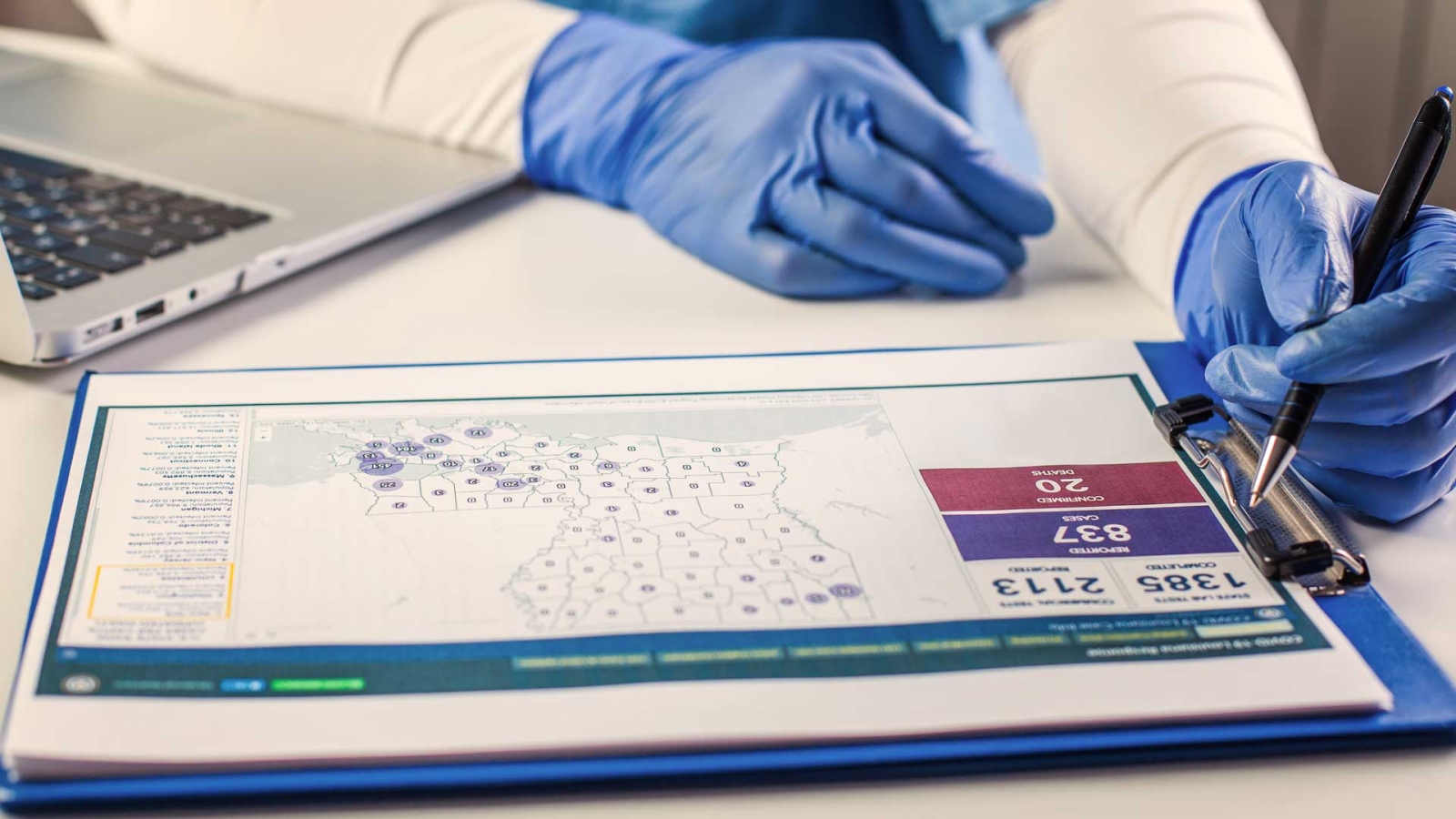 Scientist looking at medical data on clipboard