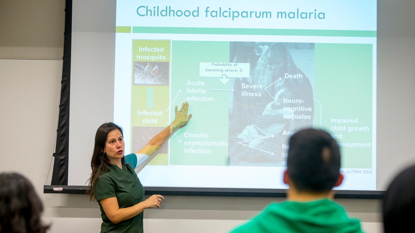 Professor pointing to projection screen