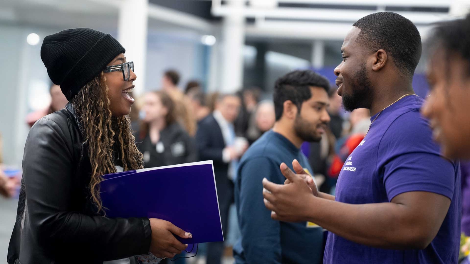 Students talking at an admissions event