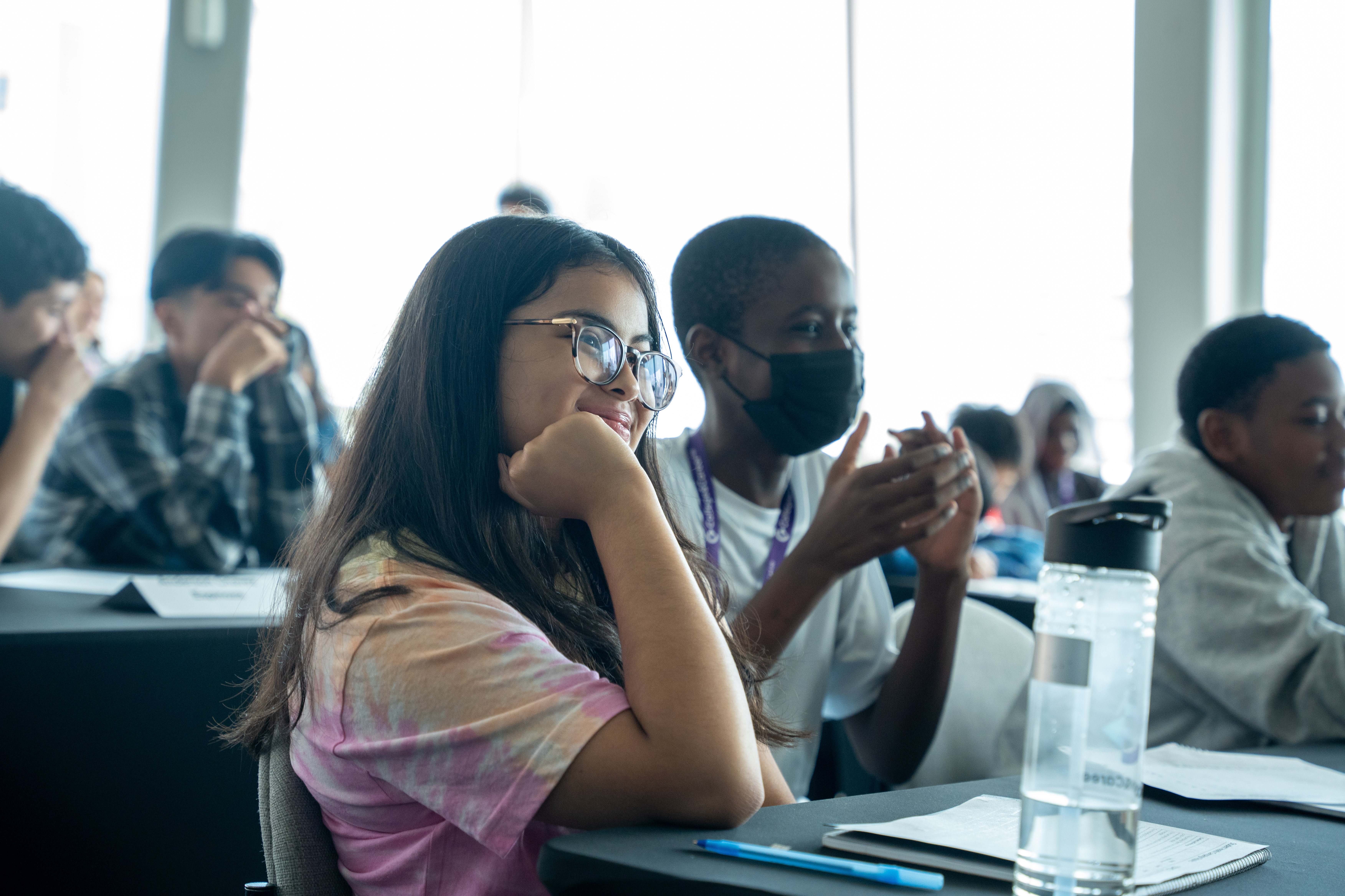 Students listing to peer presentations