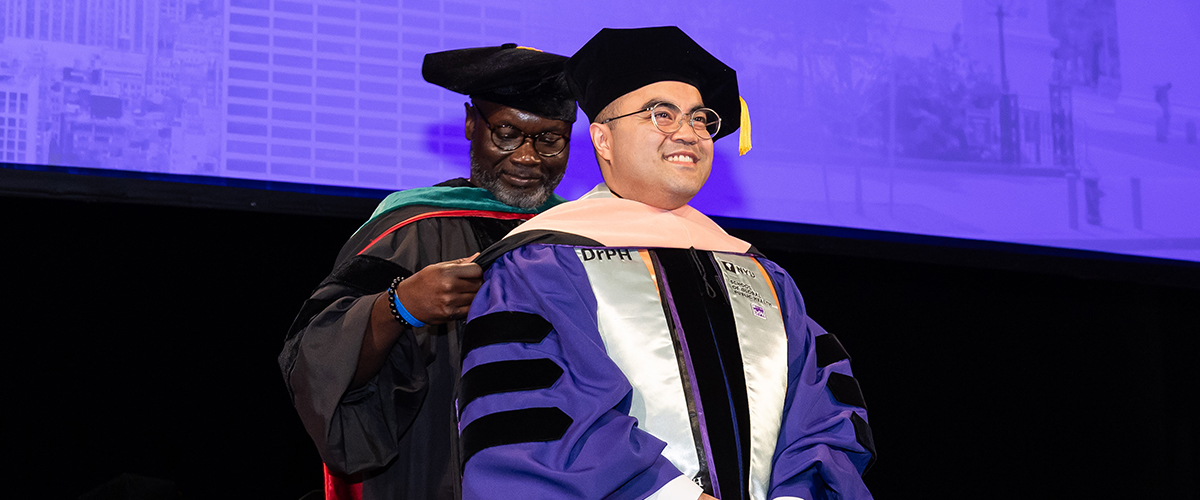 John Pateña being hooded by Emmanuel Peprah