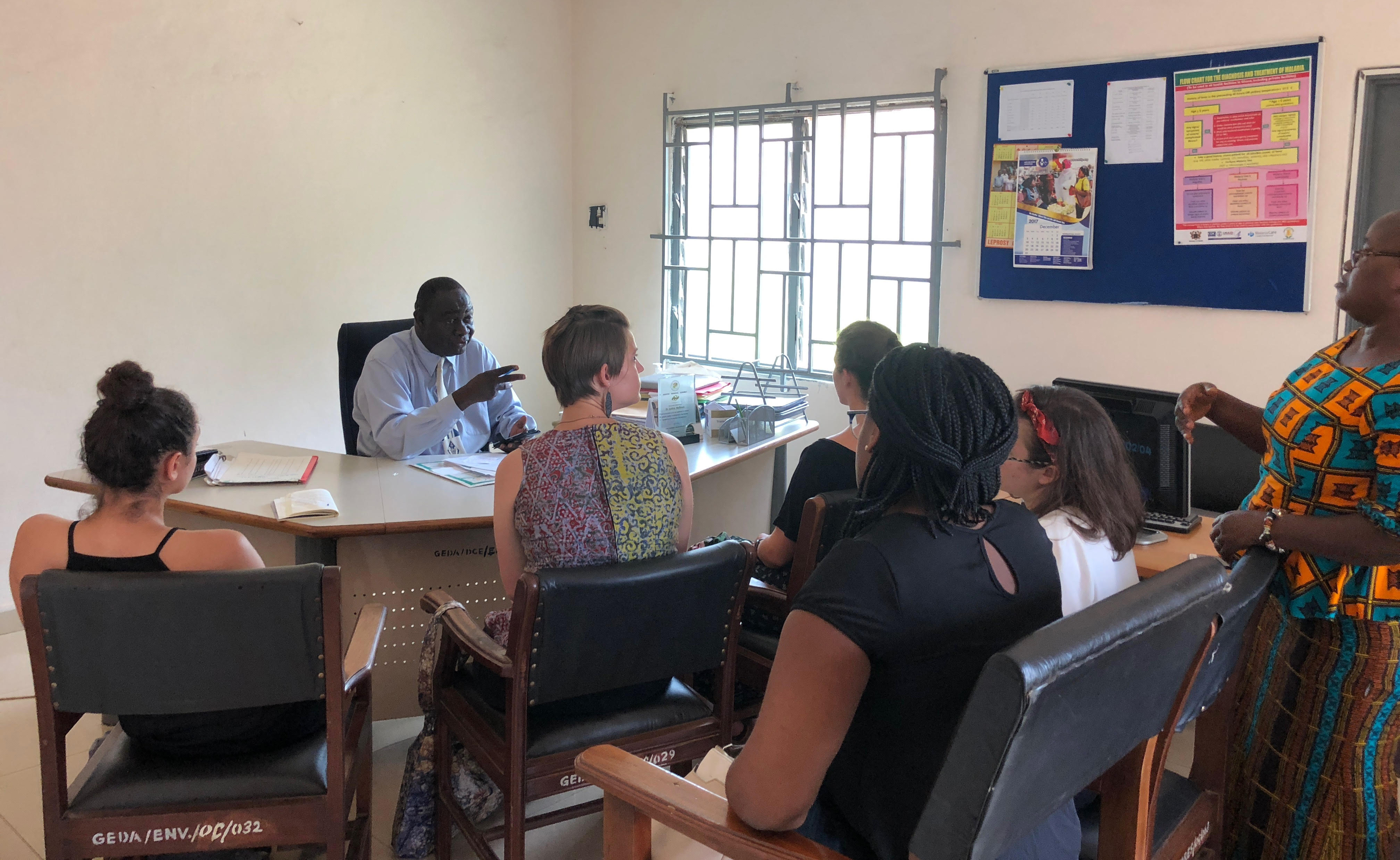 Students meeting with the community health director in Ga East