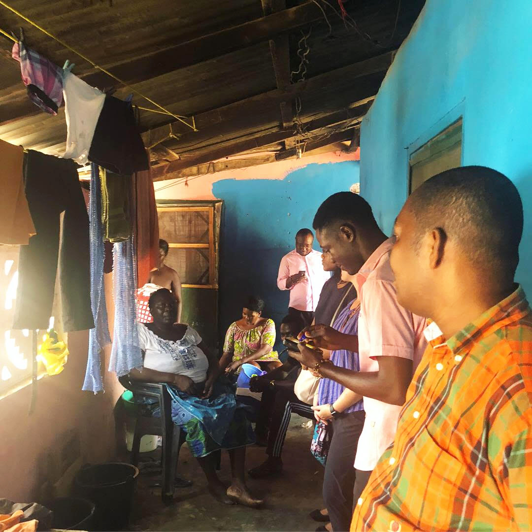 Students visit a local neighborhood with a Dodowa researcher to observe their electronic data collection.