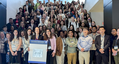 Conference participants pose for a large group show