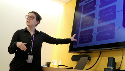 DrPH Student presenting in front of a monitor