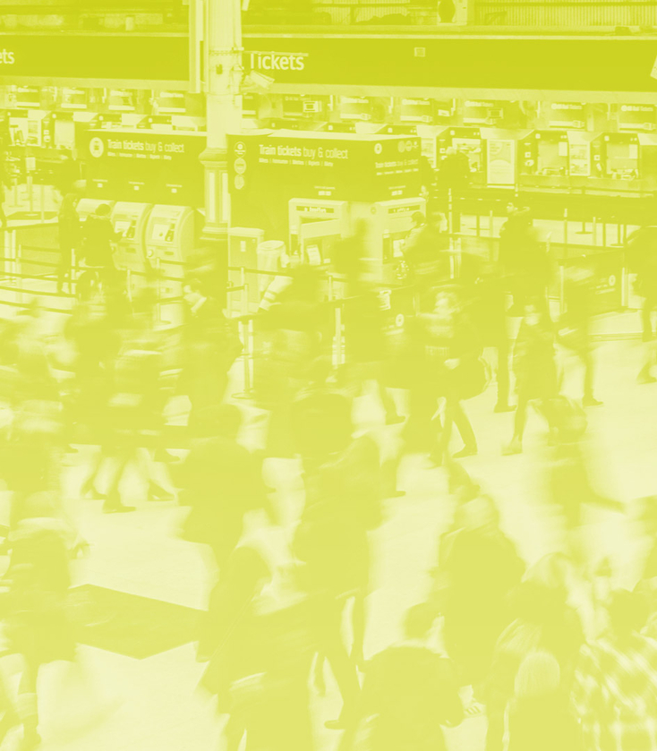 Epidemiology Header Image Wide People walking through train station