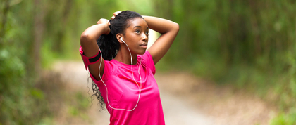 black woman jogging in a park