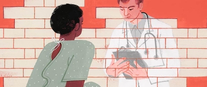 A Black woman patient talking to a white male doctor