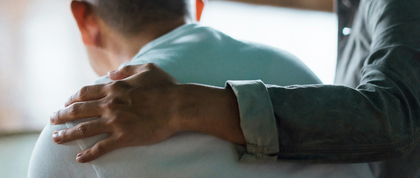 Person comforting another person