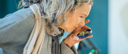 Woman smelling cannabis
