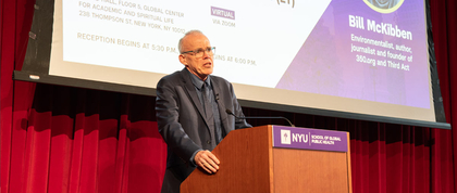 Bill McKibben speaking at the podium.