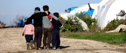 children walking in refugee camp