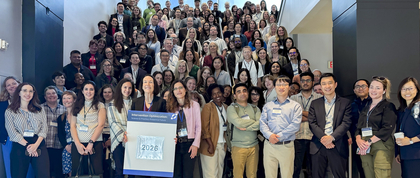 Conference participants pose for a large group show
